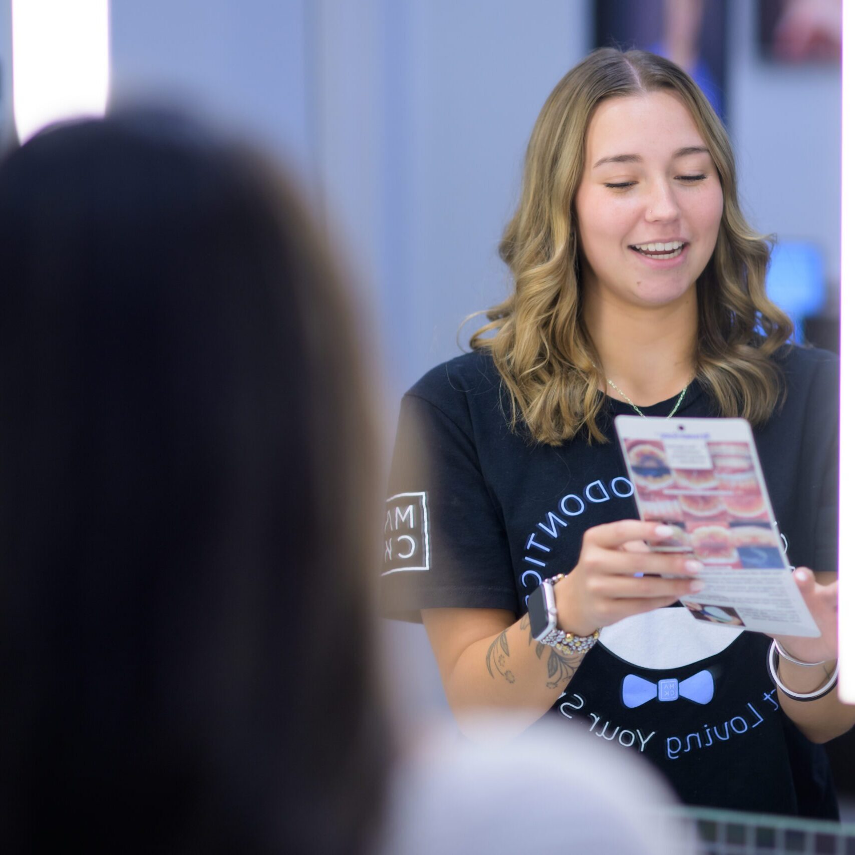 orthodontics burlington nc-000 patient reviewing details of her treatment at Mack Ortho